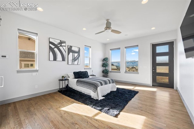 bedroom featuring baseboards, wood finished floors, a ceiling fan, and recessed lighting