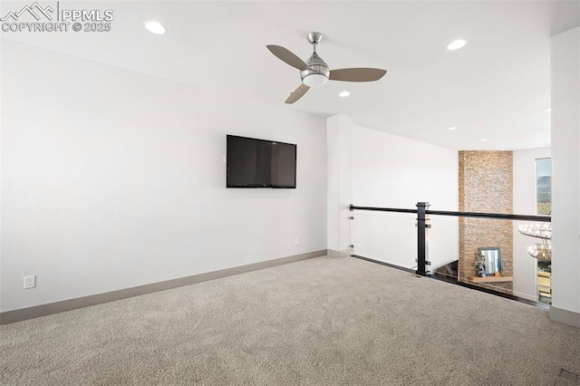 carpeted spare room featuring a ceiling fan, recessed lighting, and baseboards