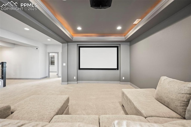 carpeted cinema room with baseboards, a tray ceiling, crown molding, and recessed lighting