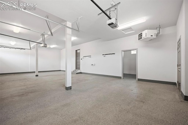 garage featuring a garage door opener and baseboards