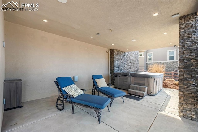 view of patio with a hot tub