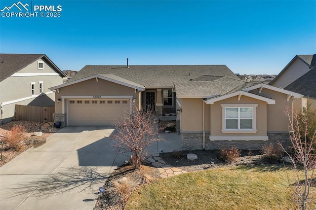 view of front of property with a garage, stone siding, driveway, and stucco siding