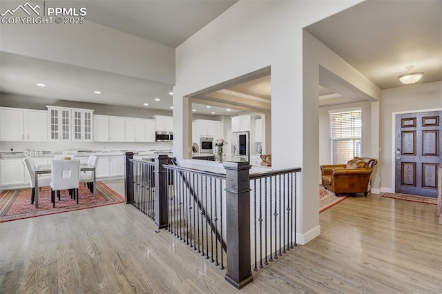 entryway with recessed lighting, baseboards, and light wood finished floors