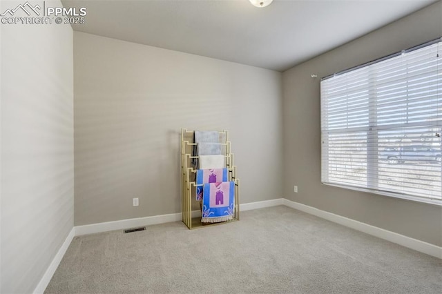 playroom featuring carpet floors, visible vents, and baseboards