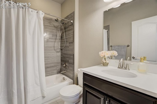 bathroom featuring toilet, shower / bath combo with shower curtain, and vanity