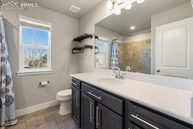 bathroom with toilet, a shower with shower curtain, visible vents, vanity, and baseboards