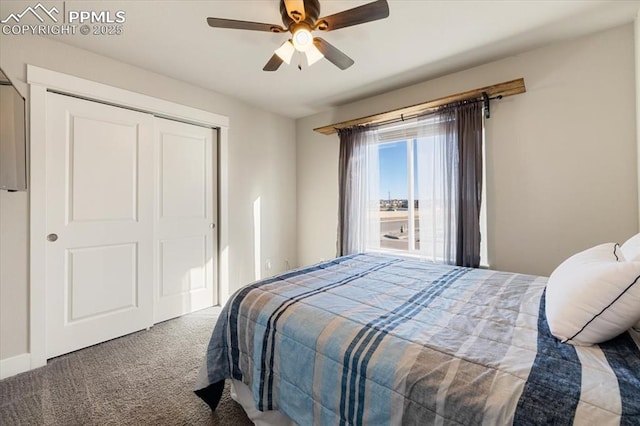 carpeted bedroom with ceiling fan, a closet, and baseboards