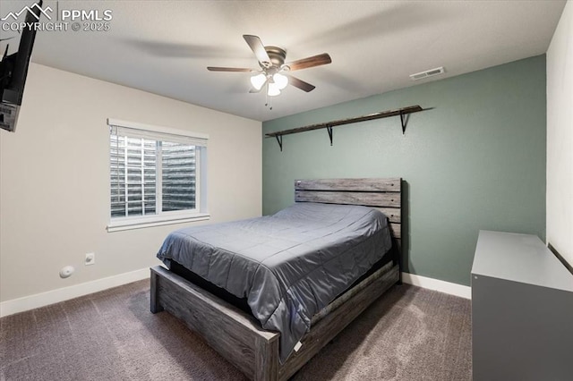 carpeted bedroom featuring baseboards, visible vents, and a ceiling fan