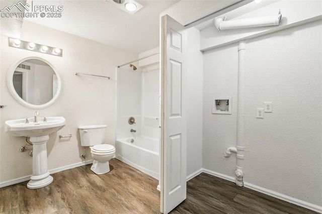 full bathroom featuring bathtub / shower combination, visible vents, toilet, wood finished floors, and baseboards