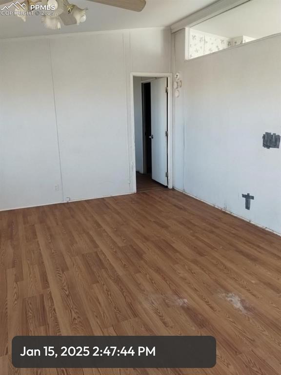 empty room featuring wood finished floors