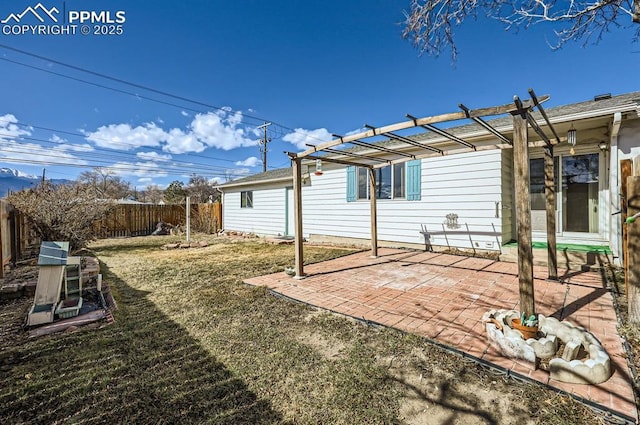 view of yard with a patio area, fence, and a pergola