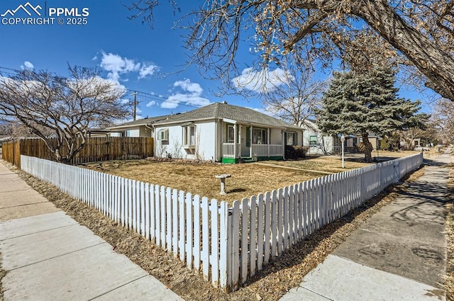 view of home's exterior featuring a fenced front yard and a porch