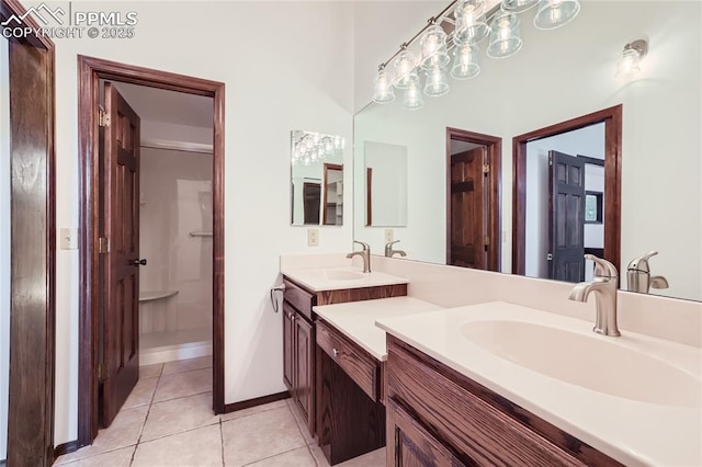 full bath with tile patterned flooring, vanity, and baseboards