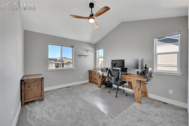 carpeted office space featuring lofted ceiling, ceiling fan, visible vents, and baseboards