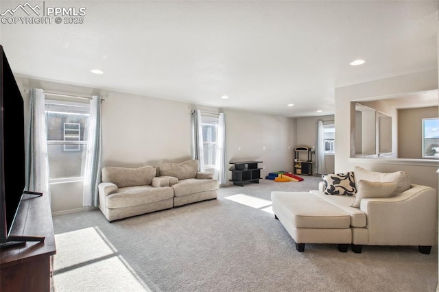 living room with carpet floors, a wealth of natural light, and recessed lighting