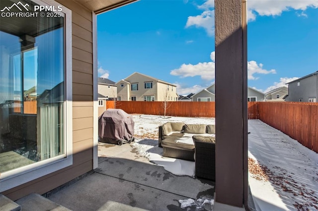 view of patio with a fenced backyard, a residential view, grilling area, and an outdoor living space