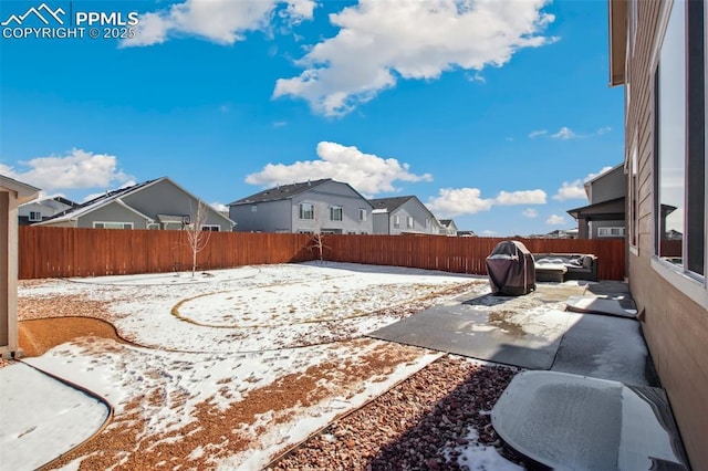 view of yard featuring a residential view, a patio area, and a fenced backyard