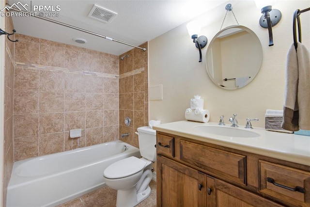 full bath featuring visible vents, toilet, tile patterned floors, tub / shower combination, and vanity