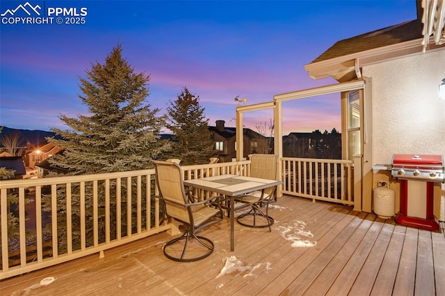 wooden deck featuring outdoor dining area and area for grilling