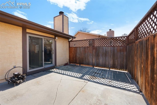 view of patio / terrace featuring fence