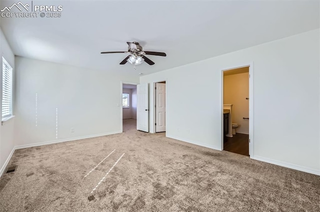 unfurnished bedroom with visible vents, baseboards, connected bathroom, ceiling fan, and carpet