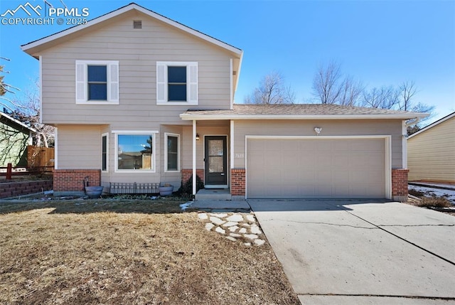 view of front of home featuring concrete driveway, brick siding, and an attached garage