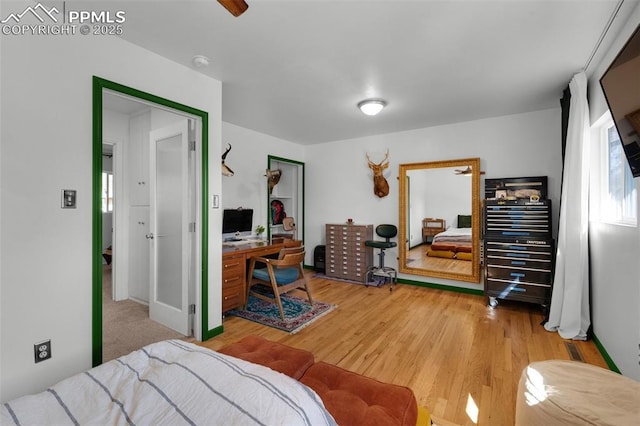 bedroom with light wood finished floors