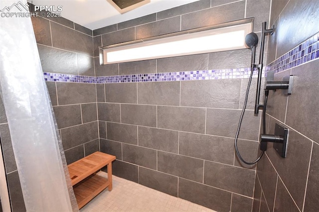 full bathroom with tiled shower