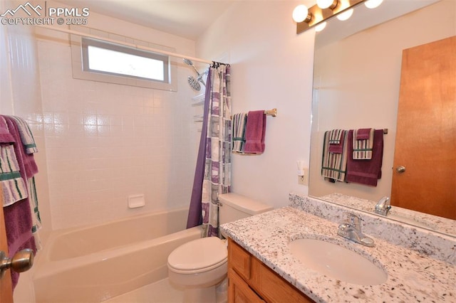 bathroom featuring vanity, shower / bath combo with shower curtain, and toilet