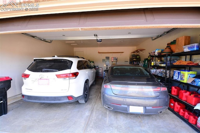 garage featuring a garage door opener