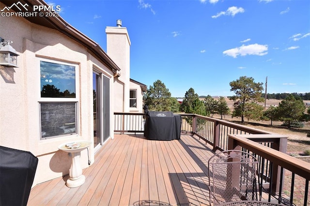 wooden deck featuring area for grilling