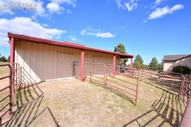 view of outbuilding featuring an outdoor structure and an exterior structure