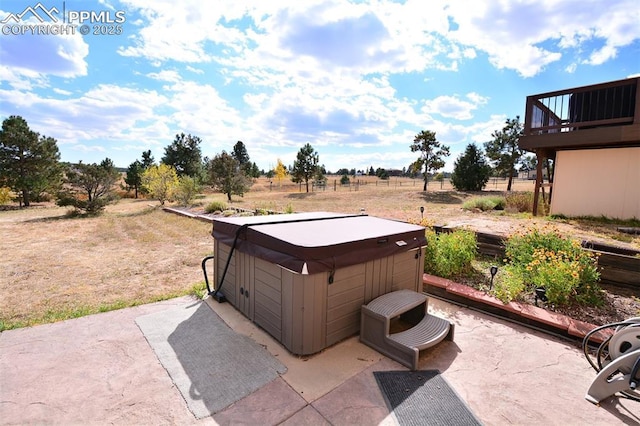 view of patio with a hot tub