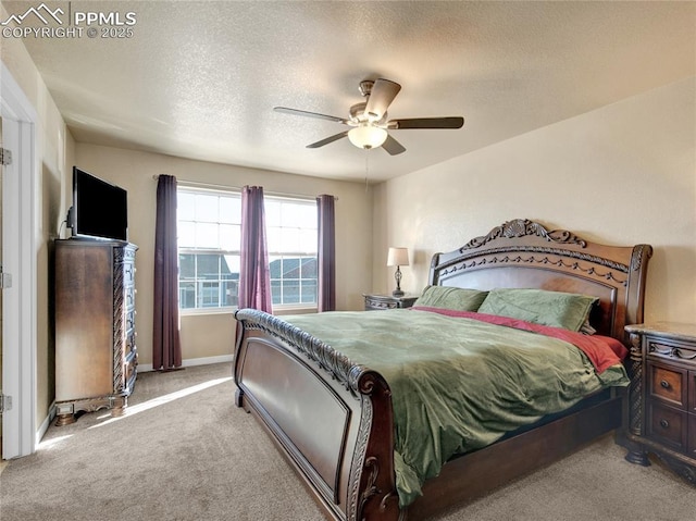 bedroom featuring light carpet, ceiling fan, a textured ceiling, and baseboards