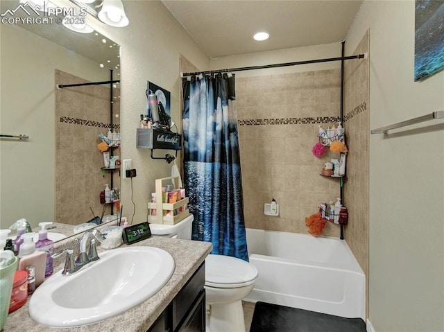 full bath featuring toilet, shower / bath combo with shower curtain, and vanity