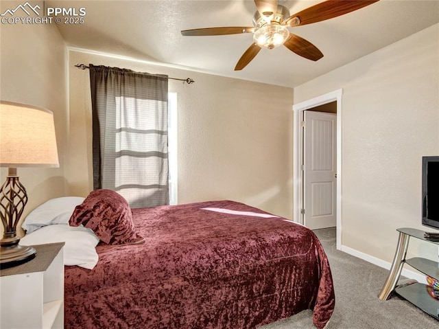 bedroom featuring a ceiling fan, carpet flooring, and baseboards