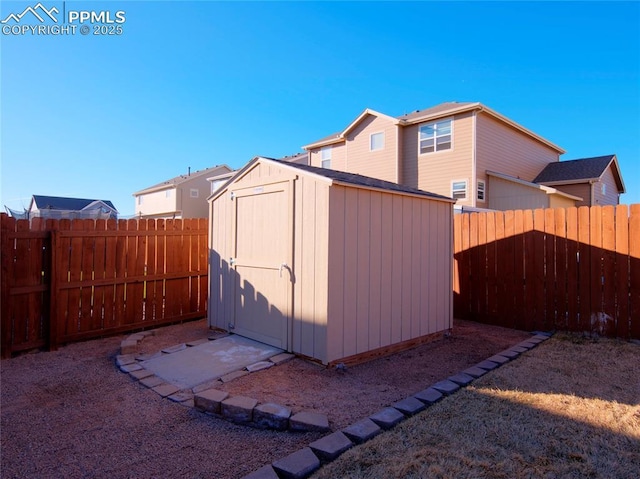 view of shed with a fenced backyard