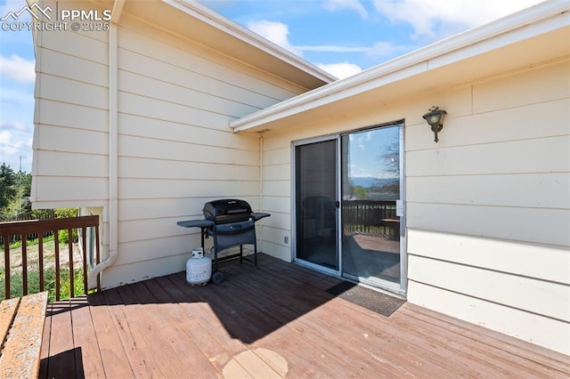 wooden deck with area for grilling