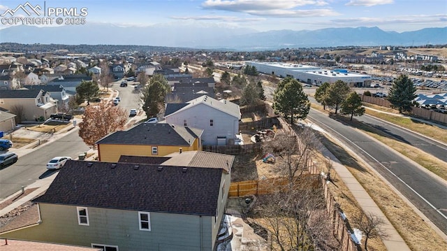 drone / aerial view with a residential view and a mountain view