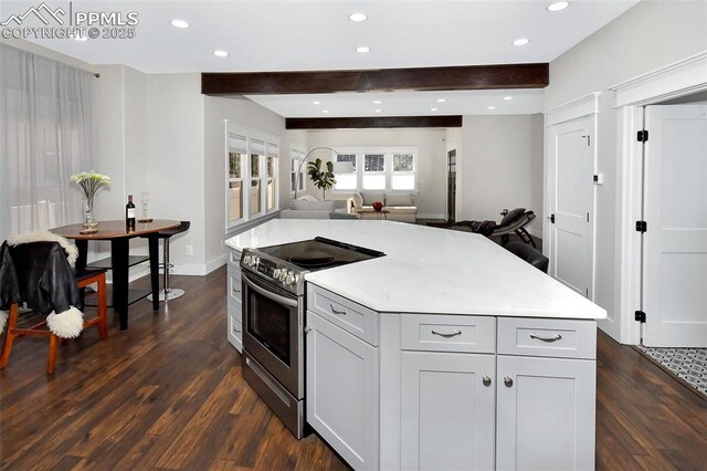 kitchen with open floor plan, dark wood-type flooring, stainless steel electric stove, light countertops, and beam ceiling