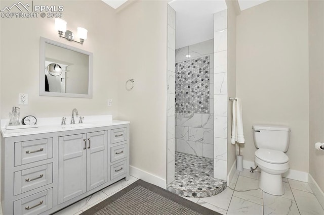 bathroom with toilet, vanity, baseboards, marble finish floor, and walk in shower