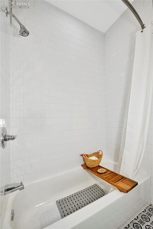 full bathroom featuring shower / tub combo