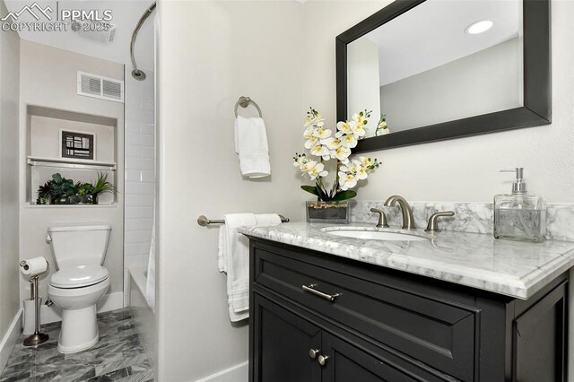 bathroom with baseboards, visible vents, toilet, marble finish floor, and vanity