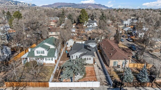 birds eye view of property featuring a mountain view and a residential view