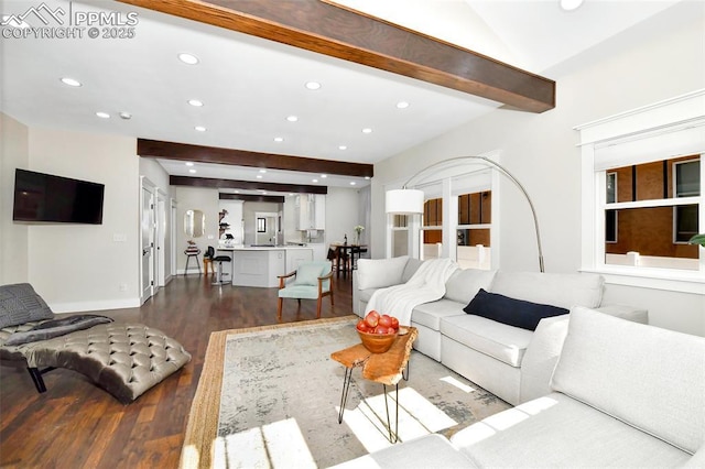 living area featuring recessed lighting, beamed ceiling, and wood finished floors