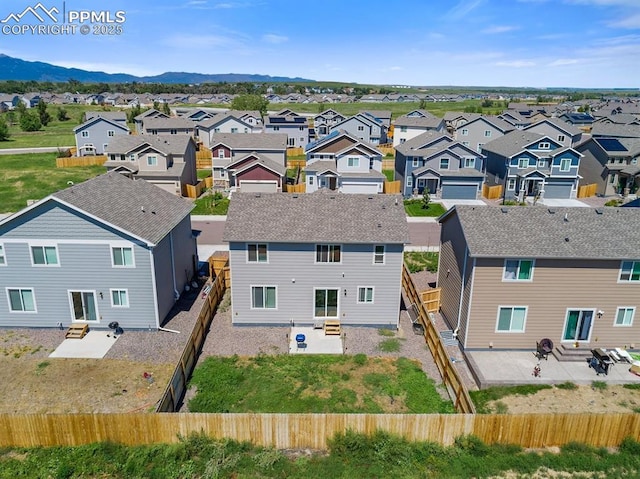 drone / aerial view with a mountain view and a residential view