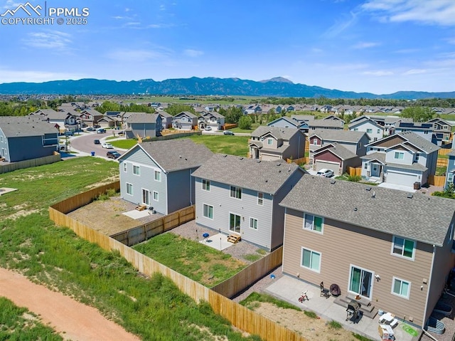 drone / aerial view with a mountain view and a residential view