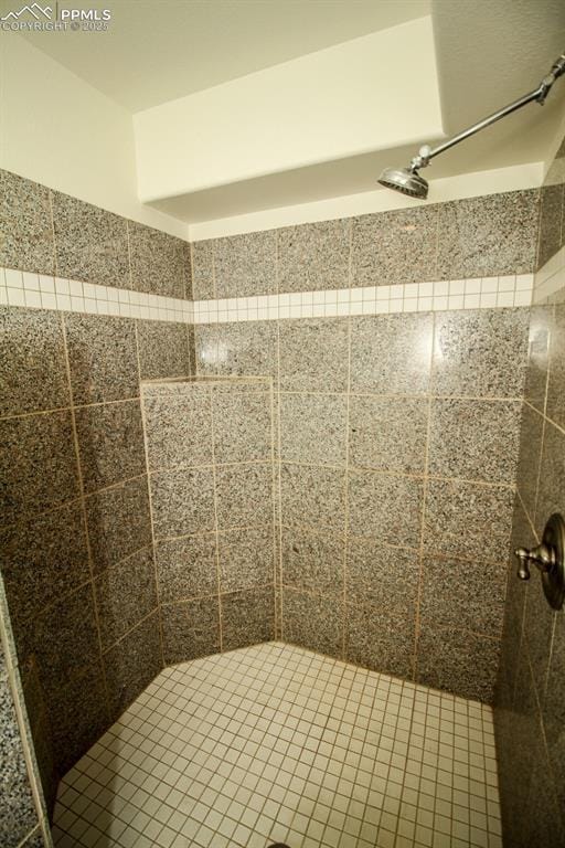 bathroom with tiled shower