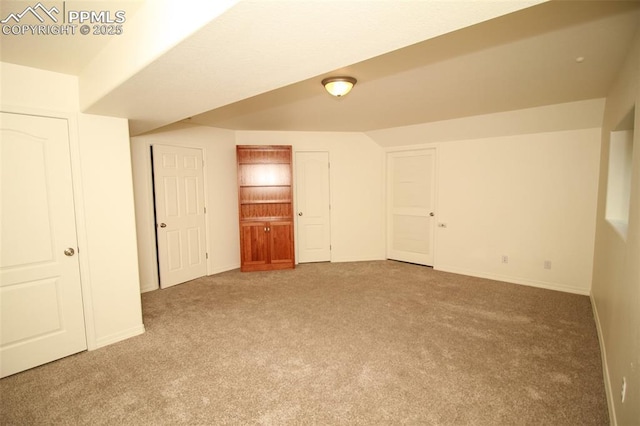 carpeted spare room with baseboards