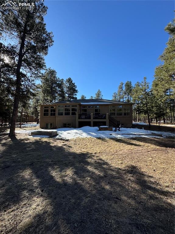 rear view of property featuring a patio